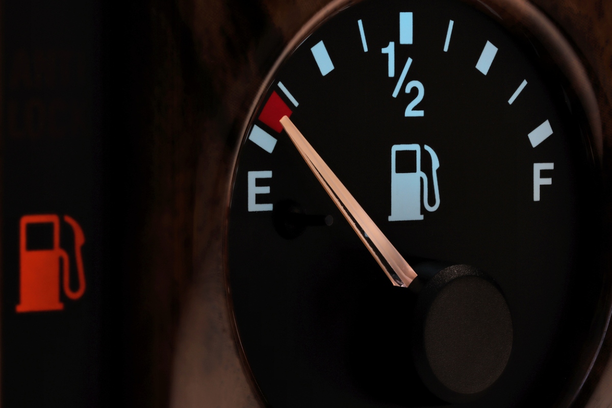 fuel gauge on car showing empty