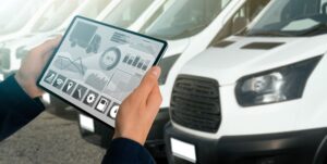 person holding iPad looking at fleet