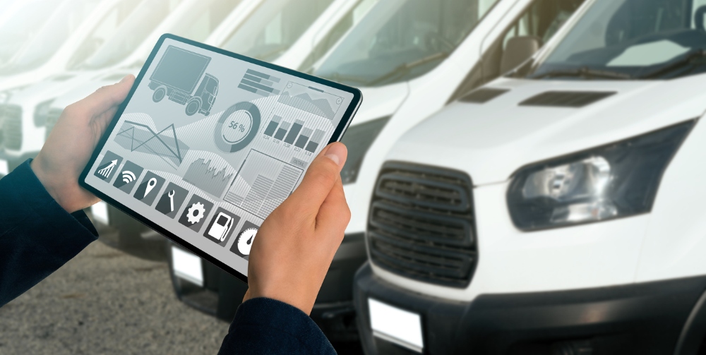 person holding iPad looking at fleet